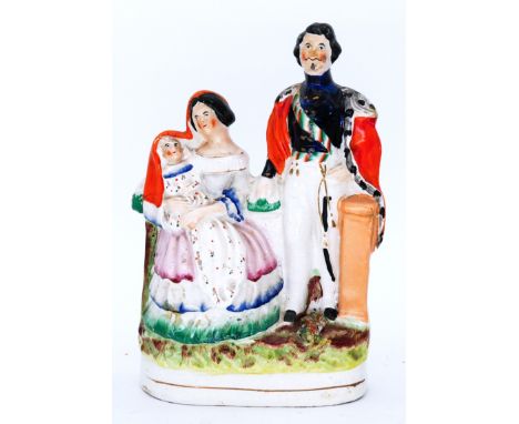 ROYALTY: A Staffordshire Pottery Royal Portrait Group, modelled as Napoleon III and Empress Eugenie, with the Crown Prince, c