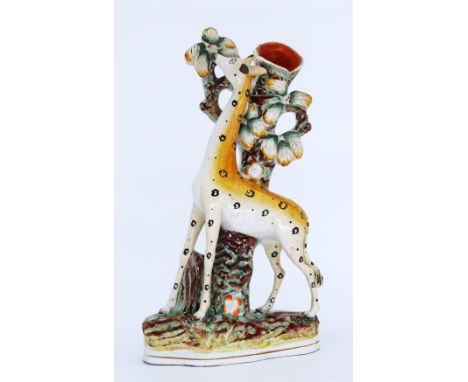 ANIMALS: A rare Staffordshire Pottery Flatback Spill Vase, modelled as a Standing Giraffe, mid 19th century,  standing before