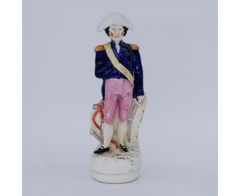 MILITARY: A rare Staffordshire Pottery Portrait Figure of Admiral Lord Nelson, mid 19th century,  modelled standing in unifor
