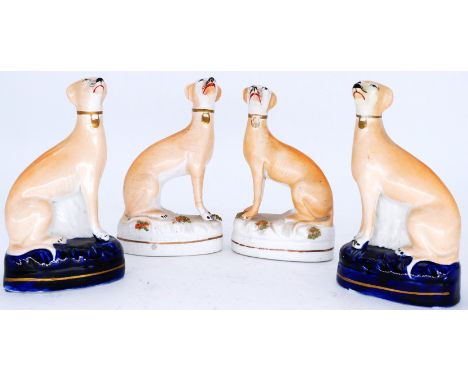 GREYHOUNDS: Two pairs of Staffordshire Pottery Dogs, modelled as seated Greyhounds, mid 19th century,  all similar on blue on