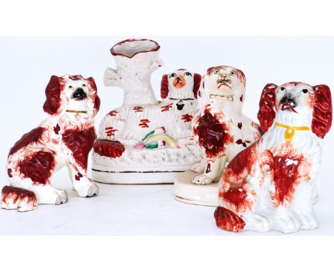 SPANIELS: Four assorted Staffordshire Pottery Dogs, including a Spill Vase with Spaniel,  recumbent with lightly spotted russ