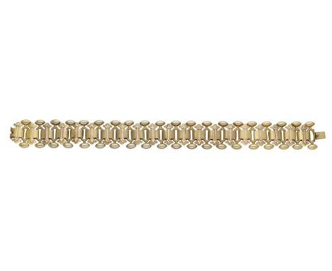 A late 19th century bicolour gold bracelet, the fancy-link bracelet with bloomed finish and applied rose gold trefoil decorat