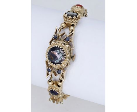 Eloga Watch Co. A lady’s gold and gem-set bracelet watch, circa 1960. Movement: manual winding, 17 jewels. Dial: silvered,  A