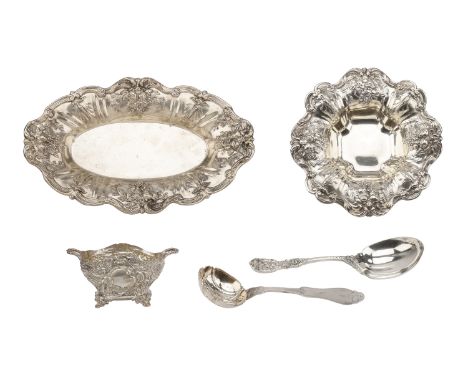 An American silver bread dish and matching sweetmeat dish, both repoussé decorated with fruit and ‘C’ and ‘S’ scroll borders,