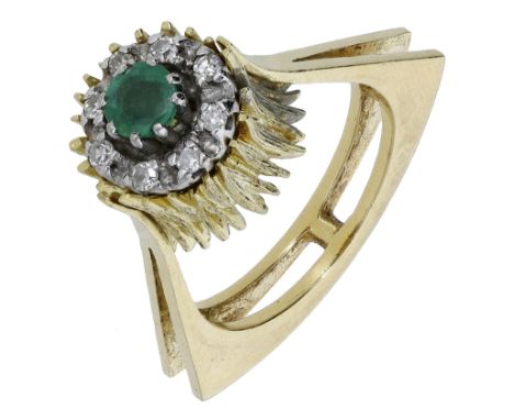 An emerald and diamond dress ring, circa 1970, of abstract form, the emerald and diamond cluster set within a textured mount,