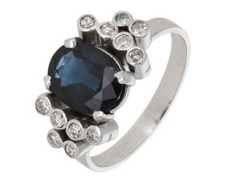 A sapphire and diamond ring, the oval-cut sapphire between shoulders collet-set with single-cut diamonds, ring size L. £200-£