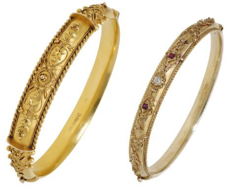 A 15ct gold bangle, 1907, with applied ropetwist and bead decoration in a scroll and foliate design, the underside with perso