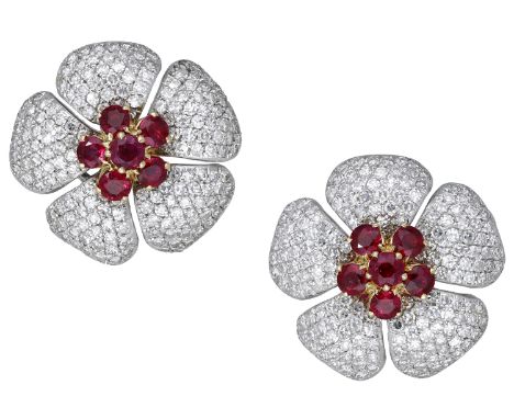 A pair of ruby and diamond earrings, of flowerhead design, each set with a cluster of circular-cut rubies with brilliant-cut 