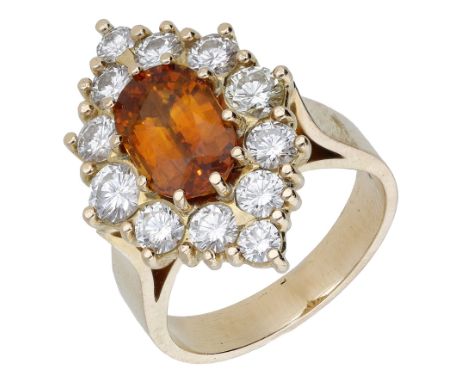 An orange sapphire and diamond dress ring, set with an oval-cut orange sapphire in a lozenge-shaped surround set with brillia