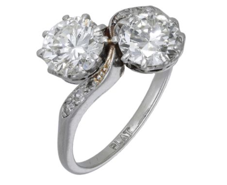 An early 20th century diamond crossover ring, the two transitional-cut diamonds claw-set between single-cut diamond shoulders