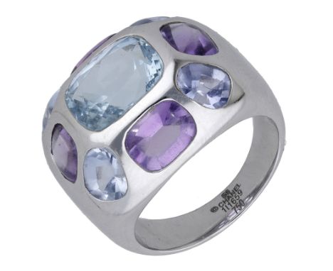 A gem-set ‘Coco’ ring by Chanel, bezel-set to the front with vari-cut amethysts and aquamarines, signed ‘Chanel’, numbered ‘1