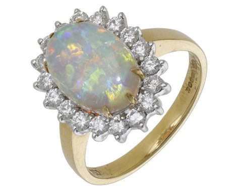 An opal and diamond cluster ring, 2007, the opal cabochon set within a surround of brilliant-cut diamonds, to a plain polishe