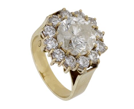 A diamond cluster ring, set with a brilliant-cut diamond, weighing 5.29 carats, within a surround of similarly-cut diamonds, 