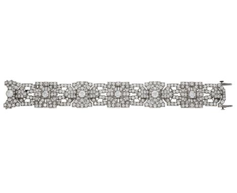 An Art Deco diamond bracelet, of openwork geometric design, set throughout with old brilliant-cut diamonds, mounted in platin