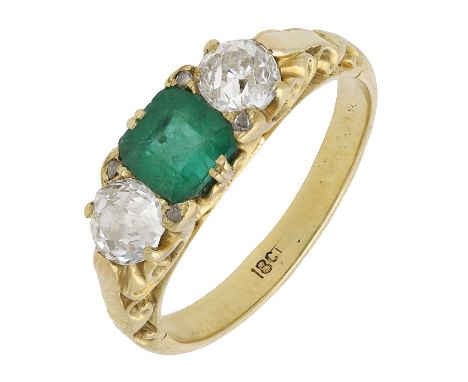 A late 19th century emerald and diamond three stone ring, the step-cut emerald claw-set between two old brilliant-cut diamond