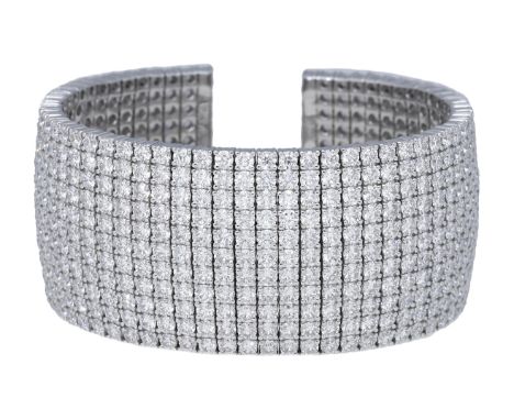 A diamond cuff, set throughout with brilliant-cut diamonds, stamped ‘750’, total diamond weight approximately 47.00 carats, i