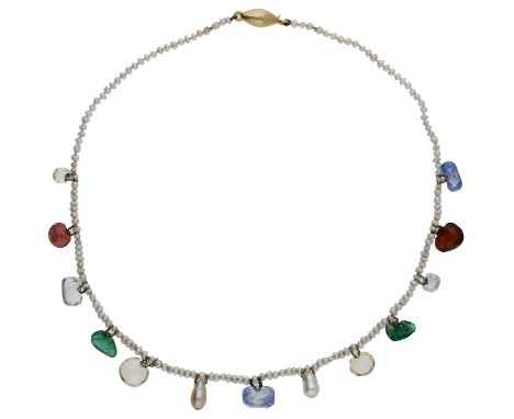 A late 19th/early 20th century gem-set necklace, the seed pearl necklace suspending a fringe of various gemstones, to include