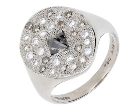 A diamond ‘Talisman’ ring by De Beers, the textured plaque set with a rough diamond crystal, the surround inlaid with brillia