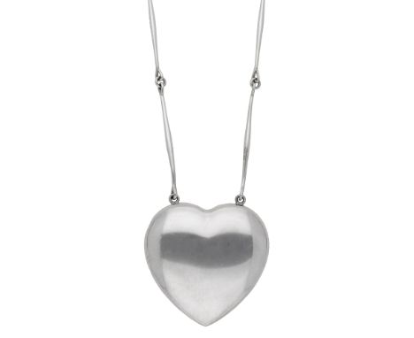 A Danish silver ‘Joy’ pendant by Georg Jensen, designed by Astrid Fog, the polished hollow heart pendant suspended by an arti