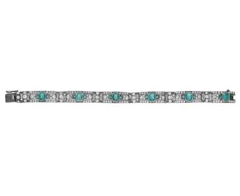 An Art Deco paste bracelet, the pierced articulated panels set throughout with circular-cut white pastes and vari-cut faceted