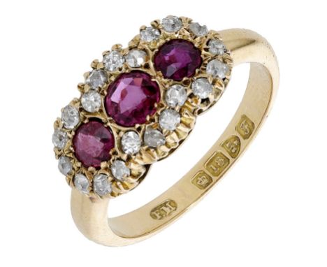 A ruby and diamond cluster ring, 1906, the three graduated circular-cut rubies each in a surround of old brilliant-cut diamon