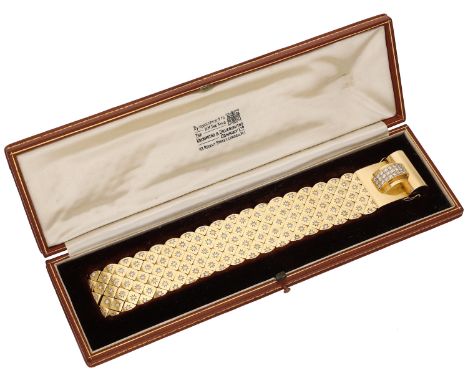 A diamond bracelet, French, circa 1940, the polished strap formed of concealed links each set with a brilliant-cut diamond wi