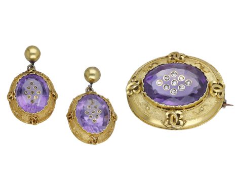 A mid 19th century amethyst and diamond earring suite, the oval-shaped amethyst inlaid with a lozenge of rose-cut diamonds, t