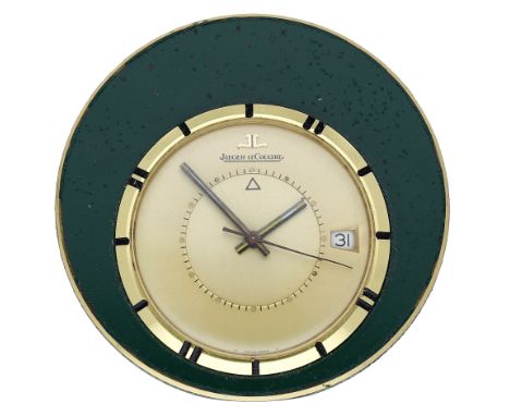 Jaeger-LeCoultre. A gilt-metal travel timpiece with alarm, circa 1960. Movement: manual winding. Dial: eccentric gilt dial, a