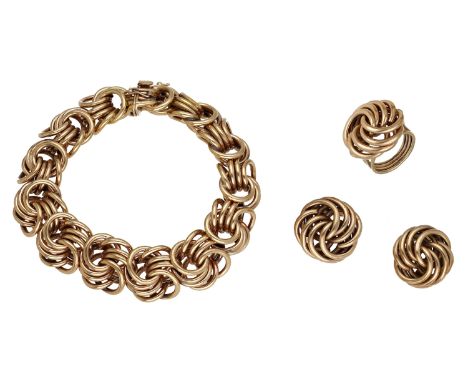 A mid 20th century bracelet, ring and ear clip suite, of woven knot design, bracelet length 20cm, ear clip length 19mm, ring 