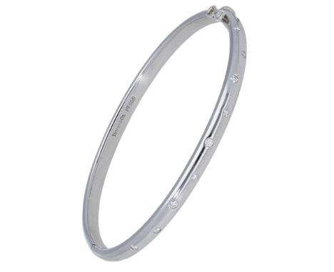 A diamond set ‘Etoile’ bangle by Tiffany & Co., the hinged bangle bezel-set to the front with brilliant-cut diamonds, signed 