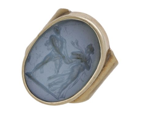 An antique glass intaglio, within 18th/19th century gold ring mount, carved to depict a classical scene with two fleeing figu