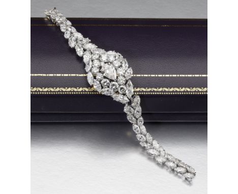 A diamond bracelet, the frontispiece centred with a pear-cut diamond, weighing 3.90 carats, of pinkish-brown tint, within a s