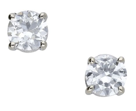 A pair of diamond ear studs, each set with an old brilliant-cut diamond, weighing 0.70 and 0.75 carat, in a four claw setting