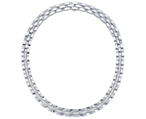 A diamond necklace, the polished brick-links set to the front with brilliant-cut diamonds, stamped ‘750’, total diamond weigh