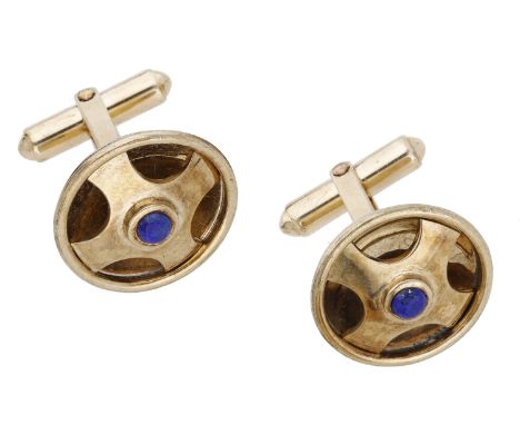 A pair of lapis lazuli set cufflinks, the hollowed domed roundels of pierced quatrefoil design and centred with a lapis lazul