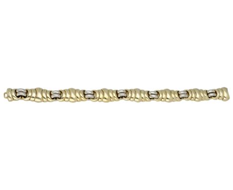 A fancy-link bracelet by Pomellato, designed as an interlocking series of bicoloured links, signed, Italian assay mark, stamp