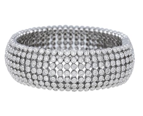 A diamond bracelet, the articulated strap set throughout with brilliant-cut diamonds, stamped ‘750’, total diamond weight app