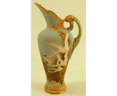 A Royal Worcester ewer, decorated with four swans on a powder blue ground, with a swallow to the reverse, by Charles Baldwyn,