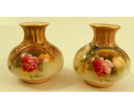 Two similar Royal Worcester vases, with quarter lobed bodies decorated with roses, one to a gilt neck the other with a silk n