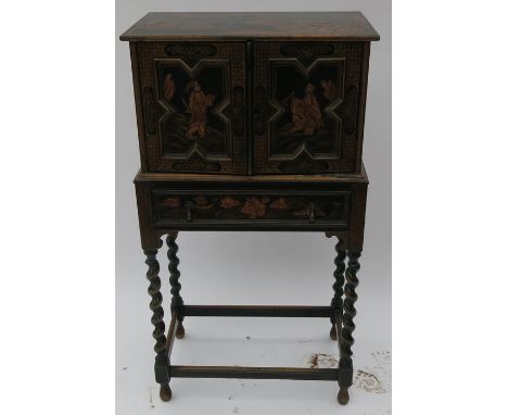 A Chinoiserie style cabinet on a stand, the two doors opening to reveal a shelf, the base fitted with a drawer, raised on bar