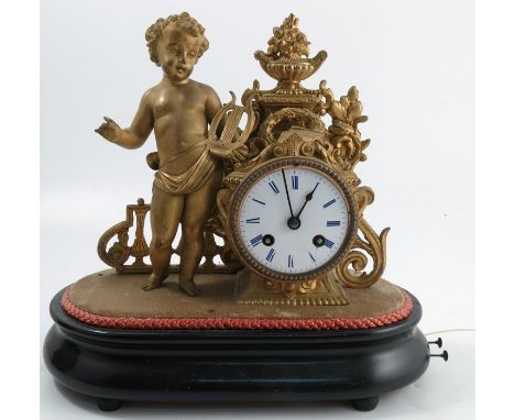 A 19th century French gilt metal musical mantel clock, the striking movement with medallion for Japy Freres, with white ename