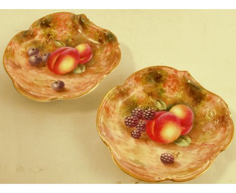 A pair of Royal Worcester dishes, decorated with fruit to a mossy background by Freeman, to a shaped edge, diameter 4.75insCo