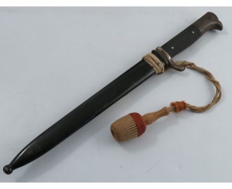 A WWII Wehrmacht dress bayonet, the blade marked Curna, with black metal scabbard