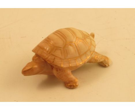 A Royal Worcester blush ivory netsuke, modelled as a tortoise, dated 1911, length 2insCondition Report:  Chip to tip of tail