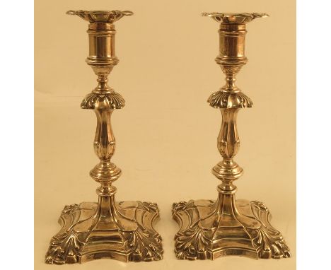 A pair of silver candlestick, with shell decoration the corners of the scones and stepped foot, Sheffield 1958, maker&nbsp;Ha
