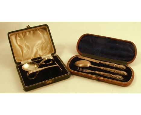 A cased Victorian silver christening set, comprising a knife, fork and spoon, with embossed handles and engraved blades, Birm