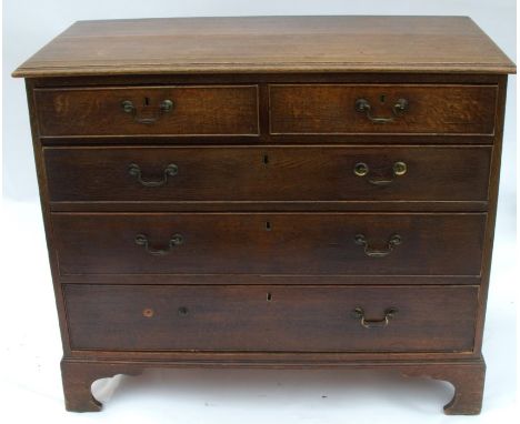 An antique oak chest of drawers, having two short drawers over three long drawers, raised on bracket feet, width 40.5ins, dep