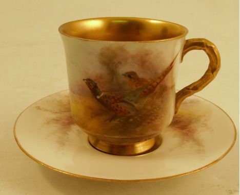 A Royal Worcester miniature coffee cup and saucer, decorated with cock and hen pheasants in a glade by Stinton, circa 1917Con