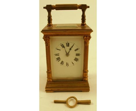 A brass cased carriage clock, with white enamel dial and Roman numerals, height including handle 6.5insCondition Report:  Mov