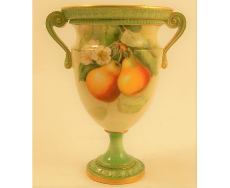 A Royal Worcester vase, decorated with pears and blossom to a green and cream glazed ground, with scroll handles, raised on a